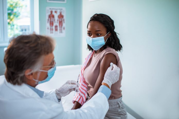 woman getting vaccinated