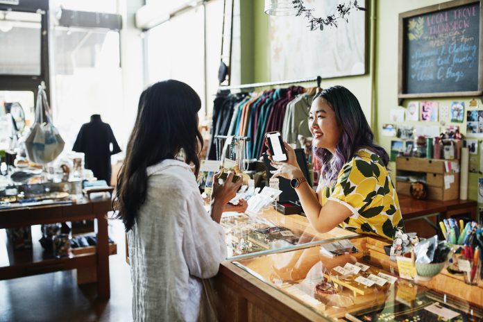 Shop owner helping customer